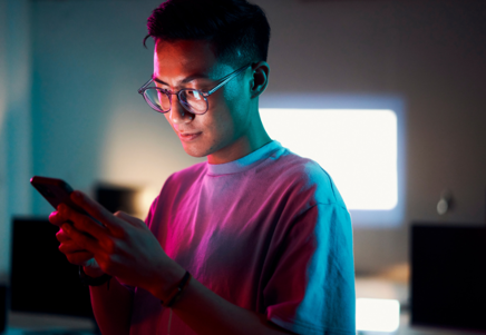 Man interacting with AI interface in a tech setting, representing Lenvi's innovations